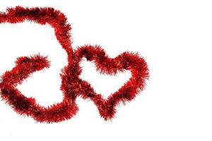 Christmas lights in the shape of heart on white background photo