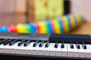 Synthesizer piano piano keys close up blurred background colorful bokeh musical instruments photo