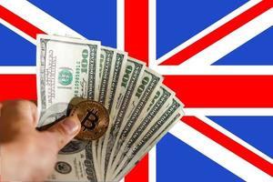 Physical version of bitcoin new virtual money and uk flag conceptual image for investors in photo