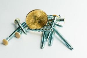 Gears and cogs close up and bitcoin coin white photo
