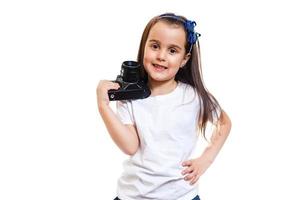 Girl taking a picture with a professional retro camera isolated on white photo