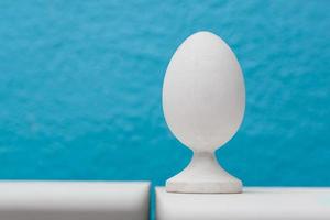 Egg on the blue wood background photo