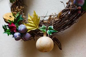 decorative wreath from a vine with dry plants photo