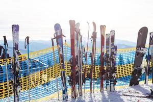 Skiing, winter season , mountains and ski equipments on ski run photo