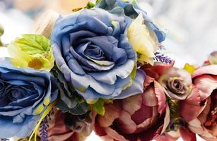 artificial colorful flowers ,fabric textured background photo