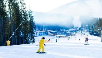 Woman skier enjoy in winter sunny day, holiday photo