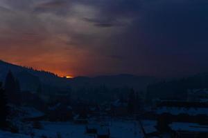 Snow house in winter dreamland at dawn in forest old weather and a lot of snow on roof photo