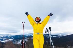 Female skier on the top of ski slope photo