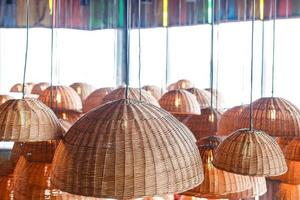 lamps in straw shades on the ceiling for decoration photo