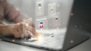 Online recruitment application and one day specialist search service concept with man finger on virtual digital interface with personal cards with rating photo