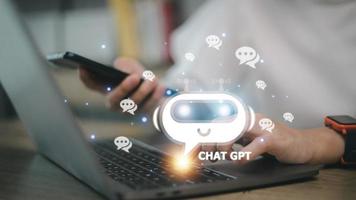 ChatGPT Chat with AI or Artificial Intelligence. woman chatting with a smart AI or artificial intelligence using an artificial intelligence chatbot developed by OpenAI. photo