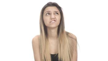 funny female model over white background crosses eyes and makes fish lips funny grimace photo