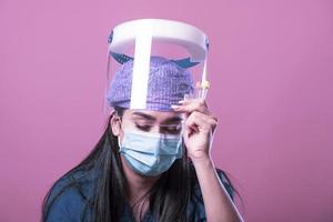 nurse in personal protective equipment of  covid-19 or coronavirus infection photo