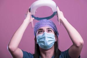 nurse in personal protective equipment of  covid-19 or coronavirus infection photo