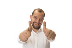 male hand showing thumbs up sign against white background photo