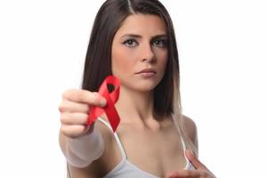 Woman holding red ribbon for December world aids day. Healthcare concept