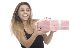 Happy beautiful woman smile and hugging gift box isolated on white background photo