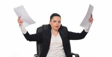 Business woman throwing work papers in the air. Stress from workload. photo