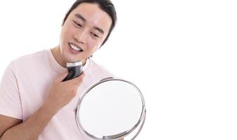 Manlooking at camera and shaving photo
