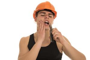 Portrait of happy young foreman with hard hat photo