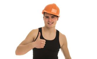 Portrait of happy young foreman with hard hat photo