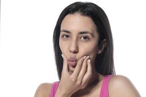 Tooth Pain And Dentistry. Beautiful Young Woman Suffering From Terrible Strong Teeth Pain, Touching Cheek With Hand. photo