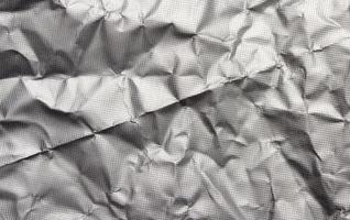silver texture of crumpled sheet of foil, full frame, element for designer photo
