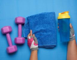 pair of dumbbells and blue towel photo