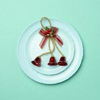 green round red ceramic plate, festive table setting for christmas and new year photo