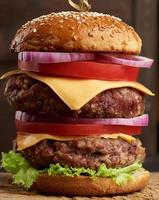 double cheeseburger with tomatoes, onions, barbecue cutlet photo