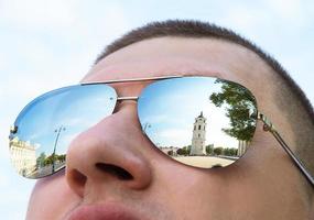 Beautiful Vilnius city is reflected in sunglasses photo