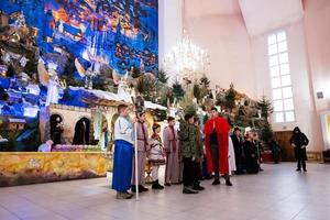 Children play nativity crib scene. photo