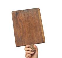 woman holding blank brown rectangular wooden board in hand photo