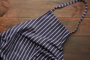 blue textile kitchen apron with white stripes photo