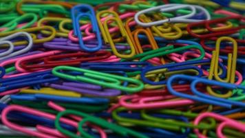 Paper clip isolated on a black background photo