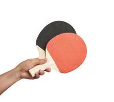 female hand holds two wooden table tennis rackets, white background photo