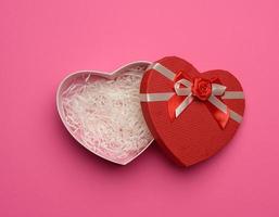 open empty red cardboard box in the form of a heart photo