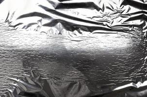 silver texture of crumpled sheet of foil, full frame, element for designer photo
