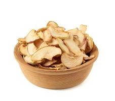 dried apple slices in wooden plate isolated on white background photo