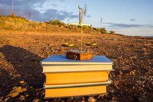 Stacked books on the ground photo