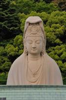 Buddha torso statue outdoors photo