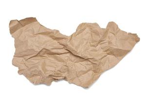 piece of crumpled brown paper isolated on white background photo