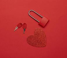 metal lock with keys and red paper heart photo