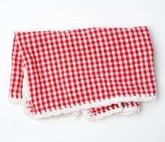 crumpled kitchen red-white towel in on a white background photo