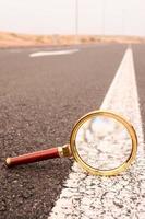 Magnifier glass on the road photo