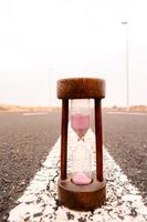 Hourglass on the road photo