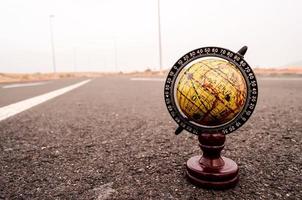 Globe on the road photo