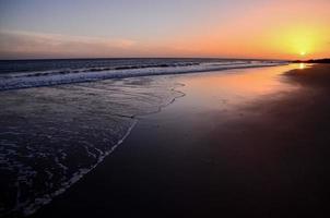 Ocean over the sunset photo