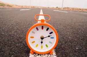 Clock on the road photo