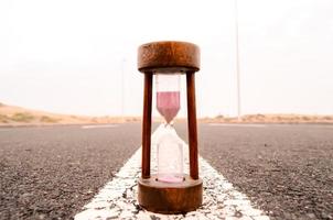 Hourglass on the road photo